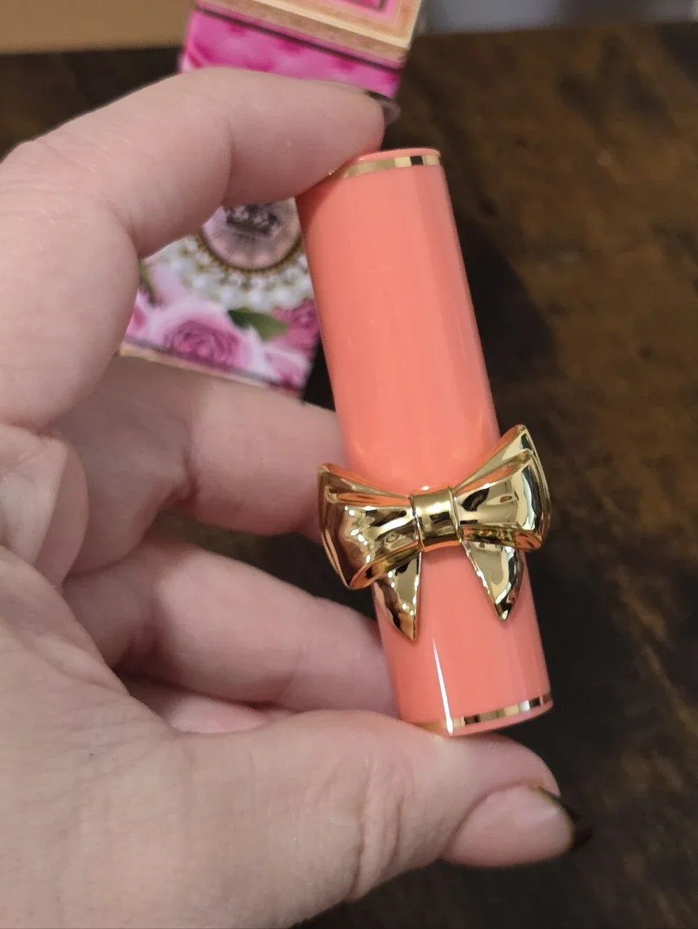 Petallicia Bright Coral Pink Lipstick with Gold Bow Accent